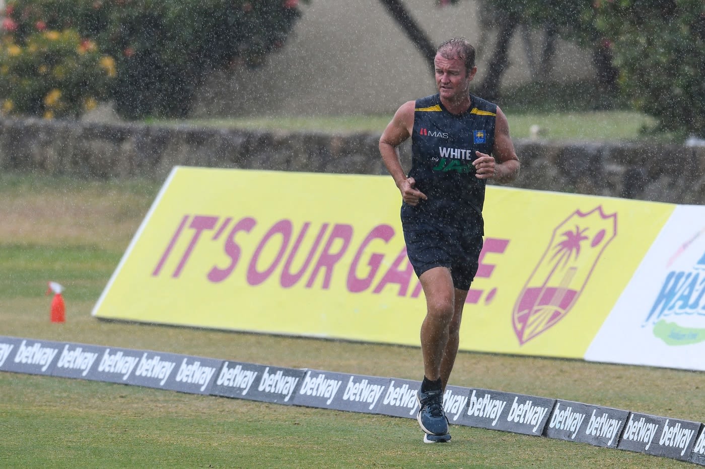 Pelting rain can't stop Sri Lanka's batting coach Grant Flower from having a run