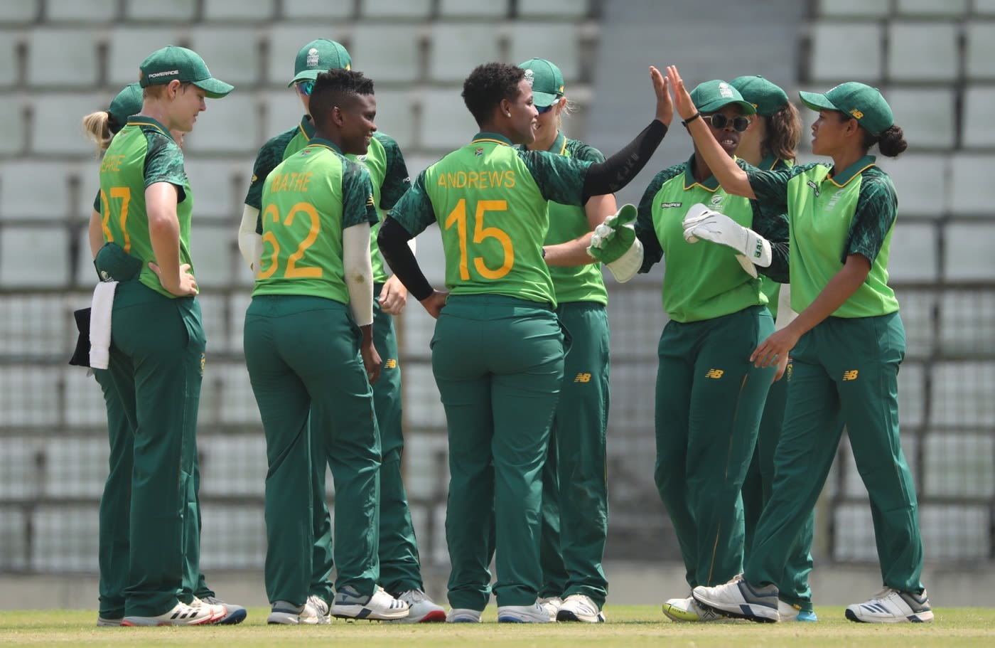 Michaela Andrews celebrates a wicket with her team-mates
