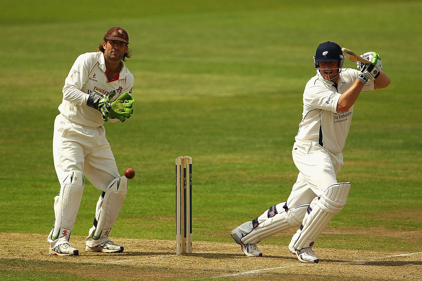Luke Sutton looks on as Anthony McGrath plays into the off side