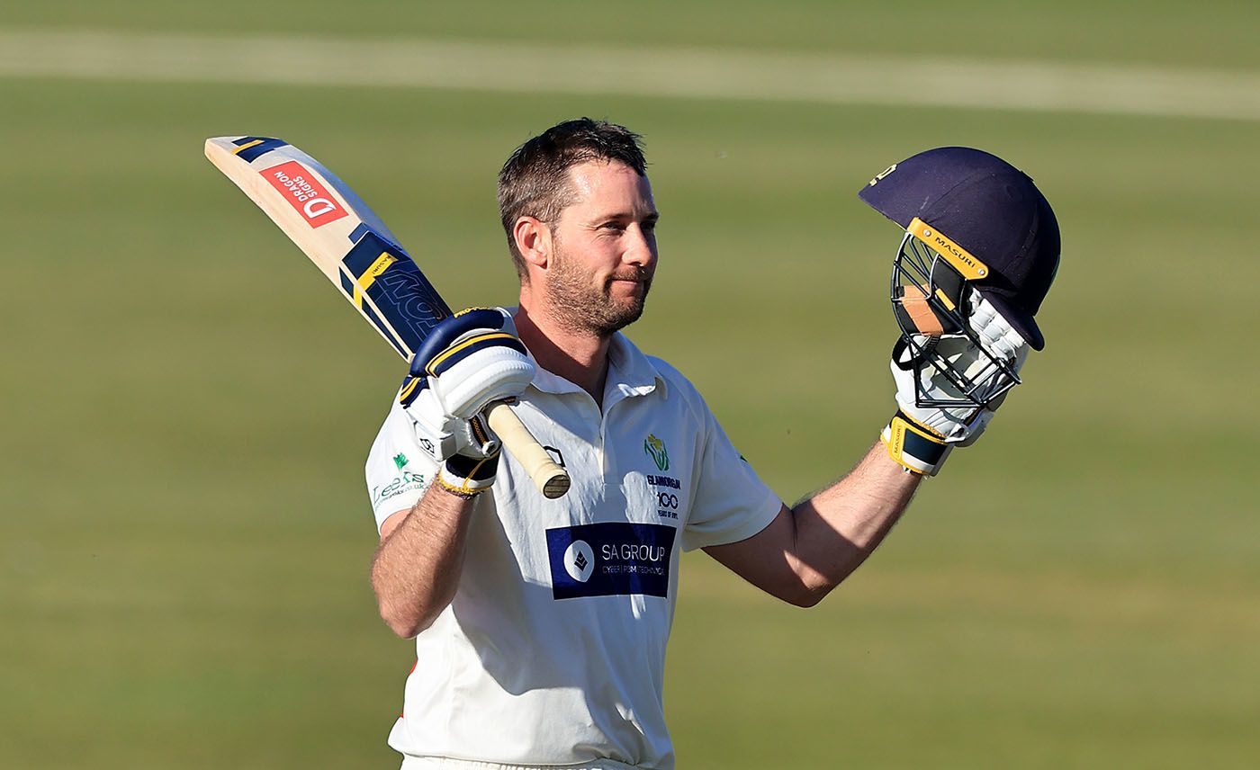 Chris Cooke celebrates his century