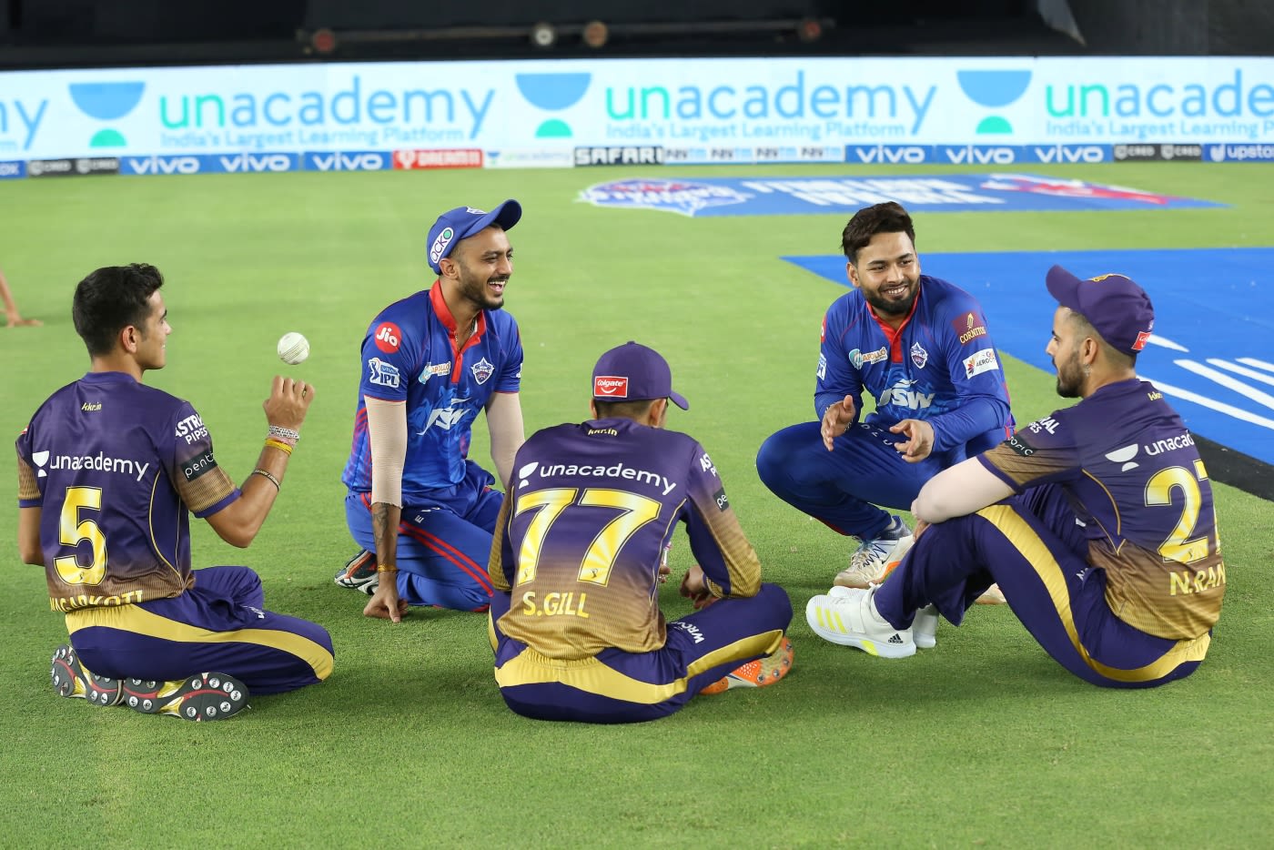 Players from both sides - Axar Patel, Rishabh Pant, Nitish Rana, Shubman Gill and Kamlesh Nagarkoti - have a chat after the game