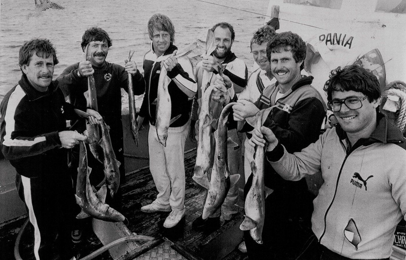 Bruce Laird, Rod Marsh, Jeff Thomson, Ray Bright, Kim Hughes, Grame Wood and the team masseur show off the catch they got at Cape Saunders