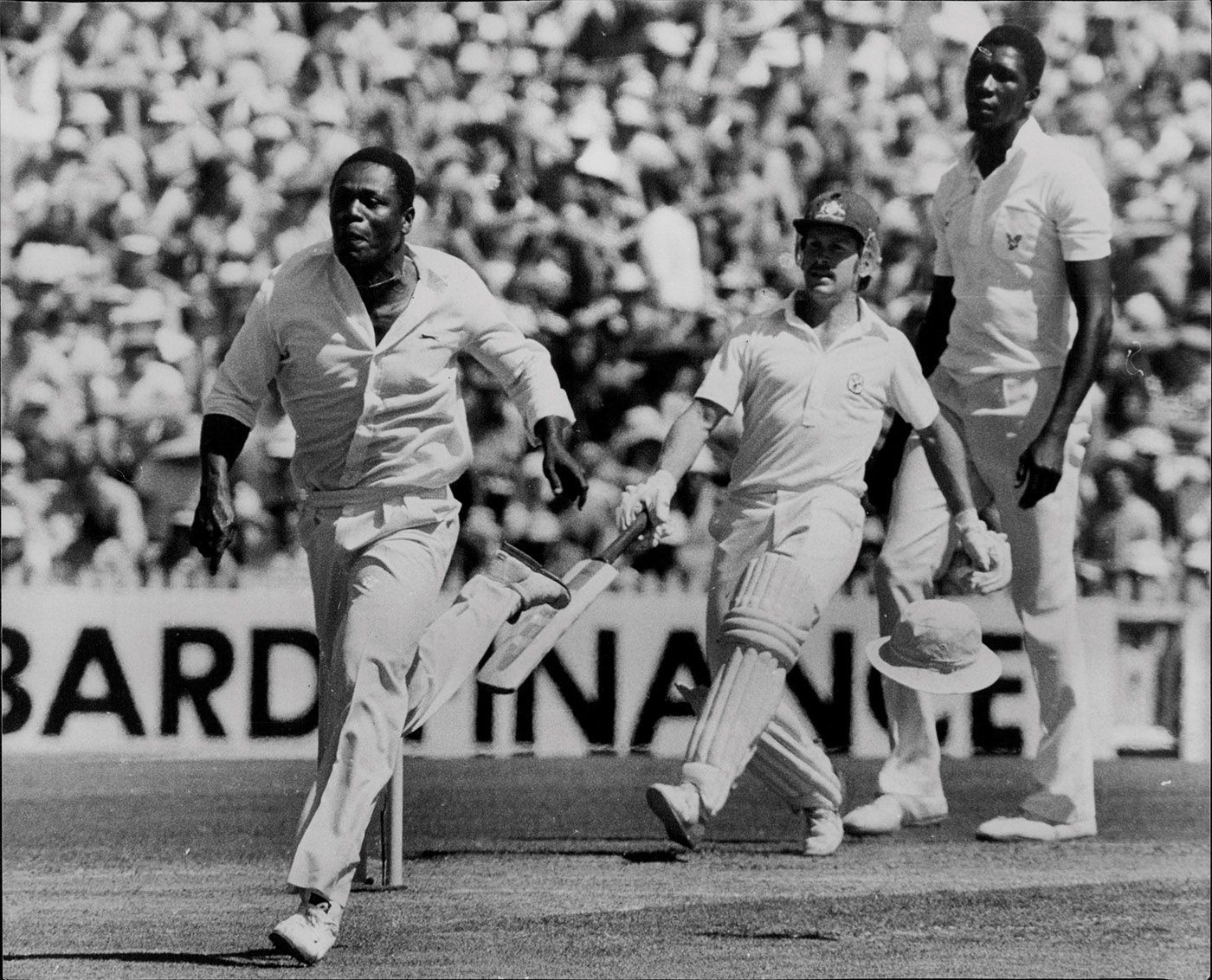 Desmond Haynes chases after a ball from Bruce Laird off the bowling of Joel Garner
