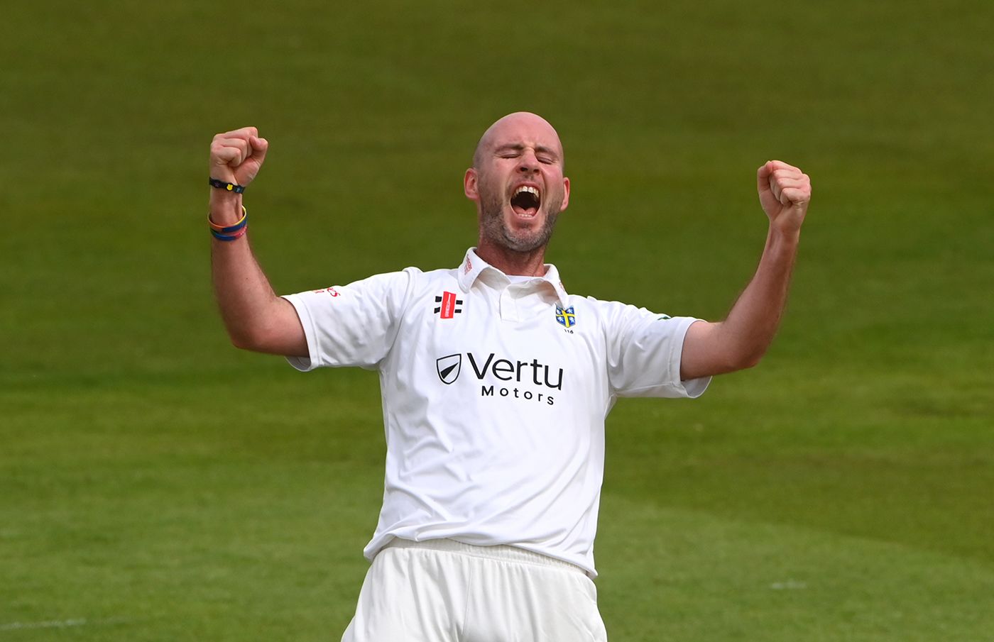 Chris Rushworth celebrates taking the wicket of Alastair Cook