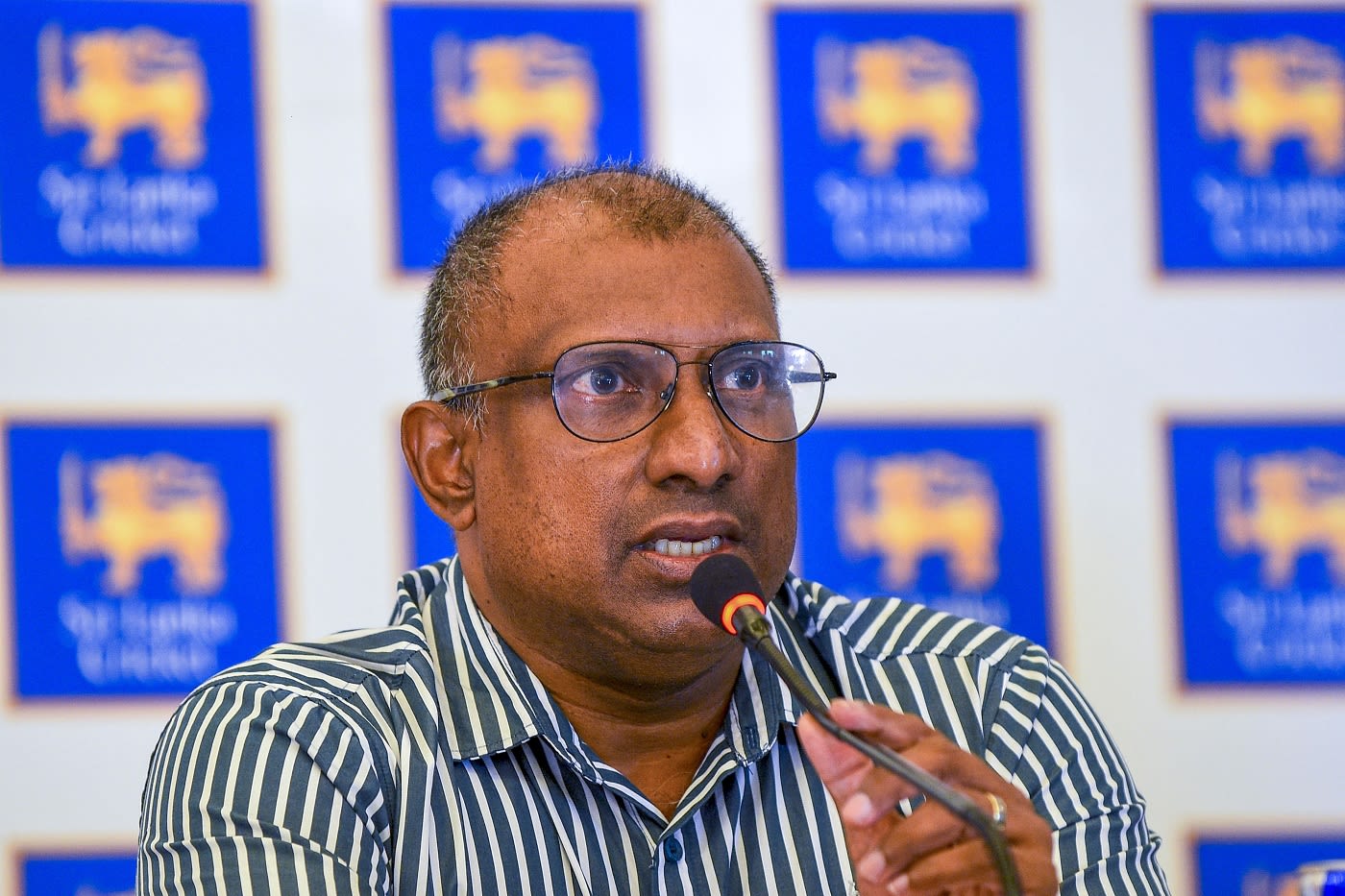 Aravinda de Silva speaks during a press conference