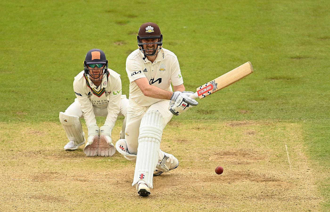 Rikki Clarke of Surrey reverse sweeps 