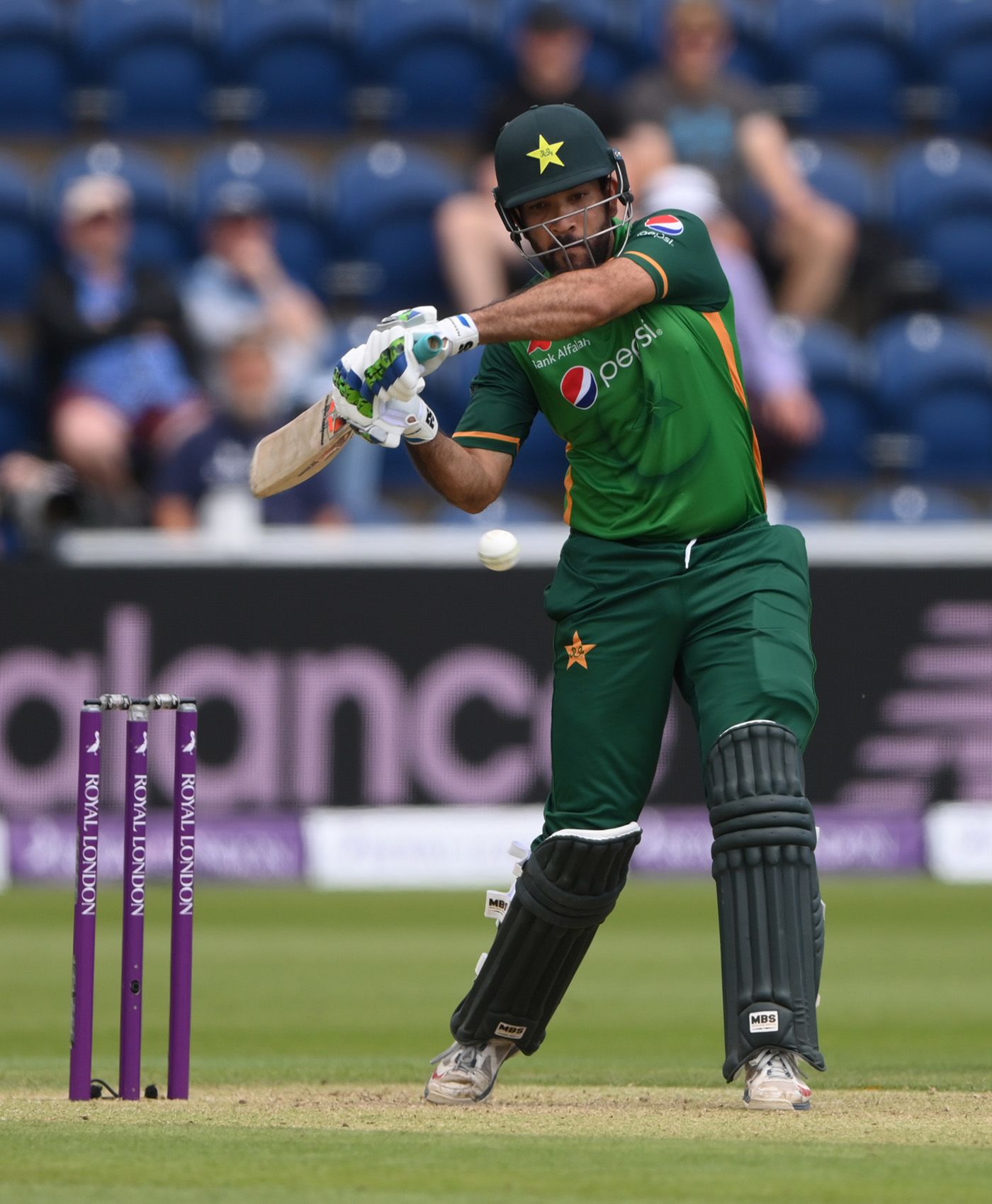 Sohaib Maqsood throws his hands at a short ball