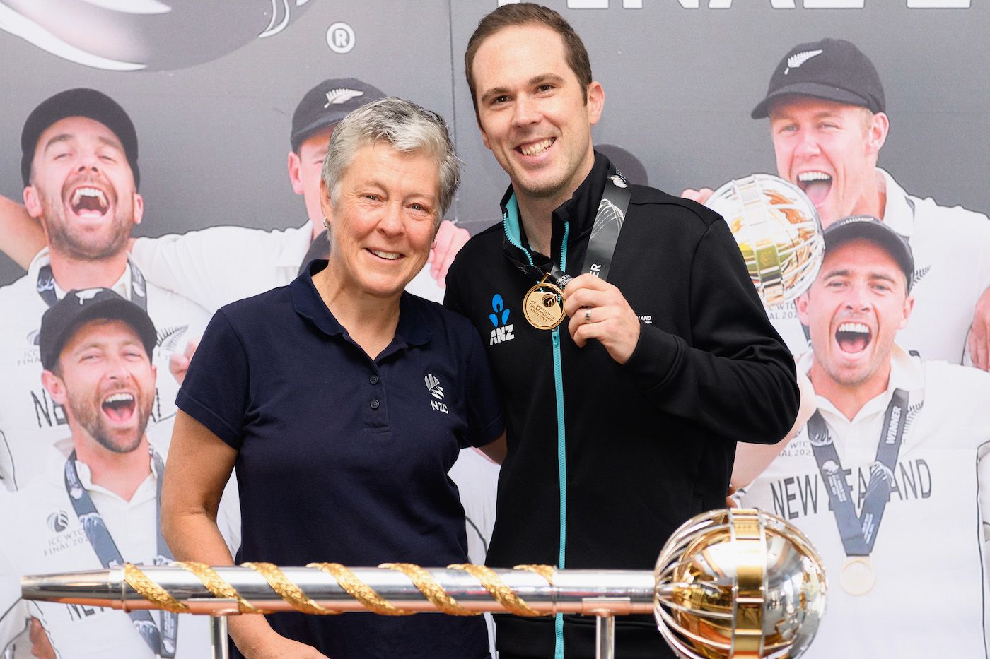 Todd Astle receives his WTC medal from NZC president Debbie Hockley