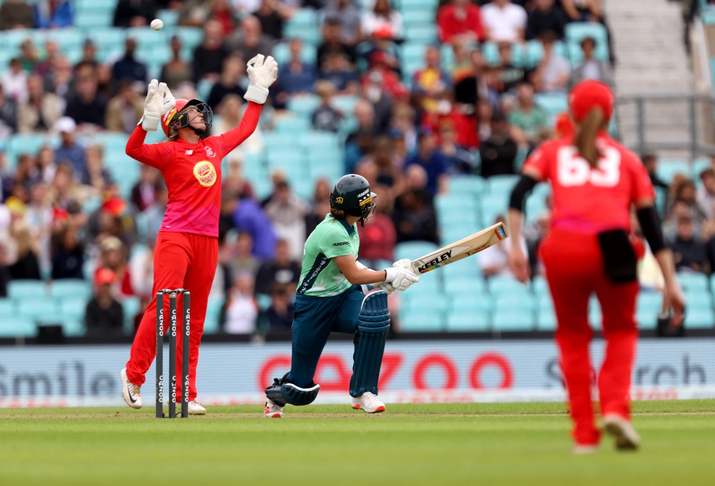 Grace Gibbs sweeps over Sarah Taylor's head
