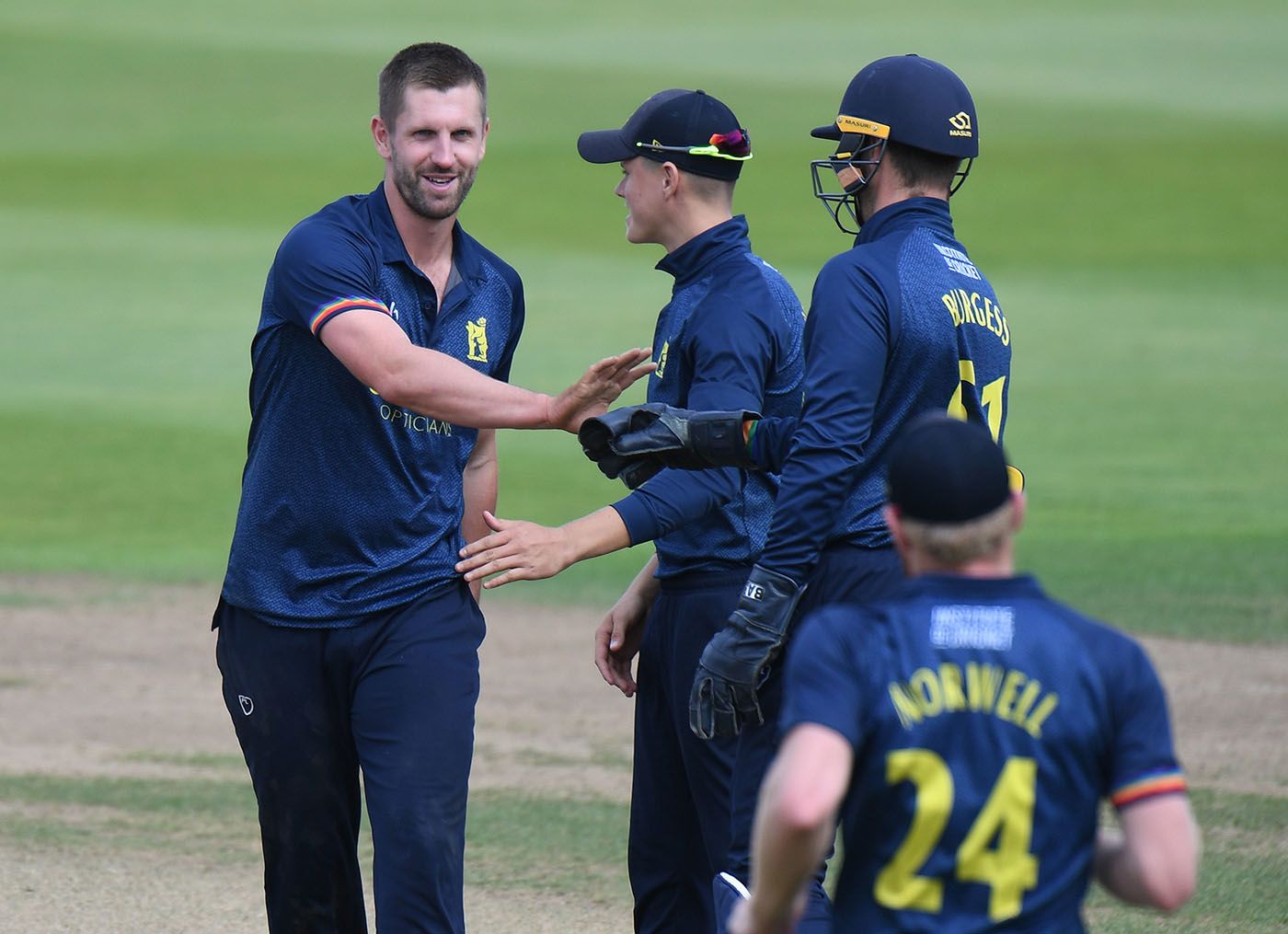 Matthew Lamb celebrates a wicket
