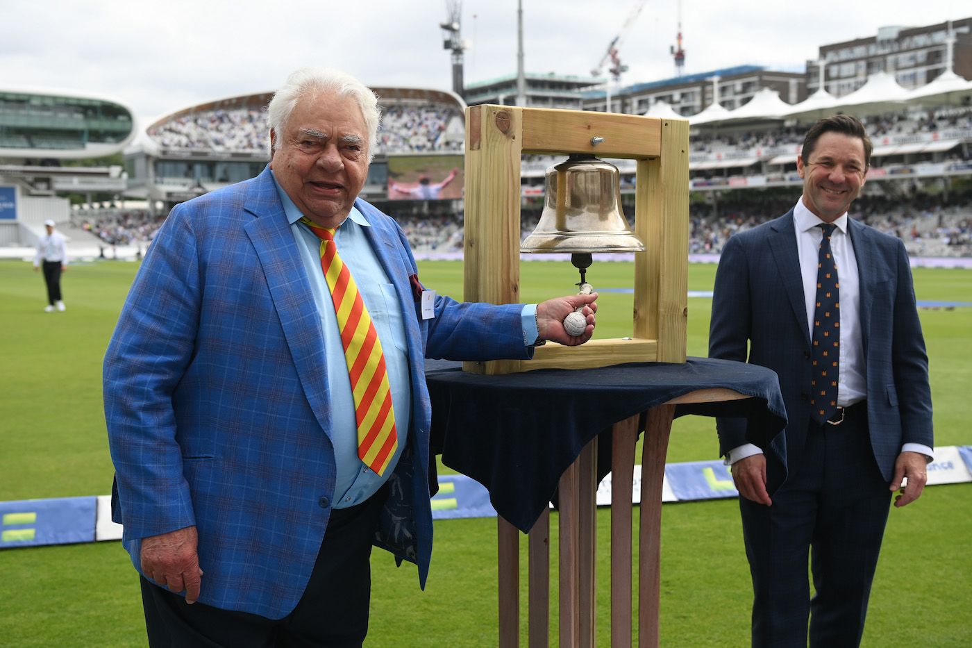 Farokh Engineer rings the Lord's bell ahead of the start of the third day's play