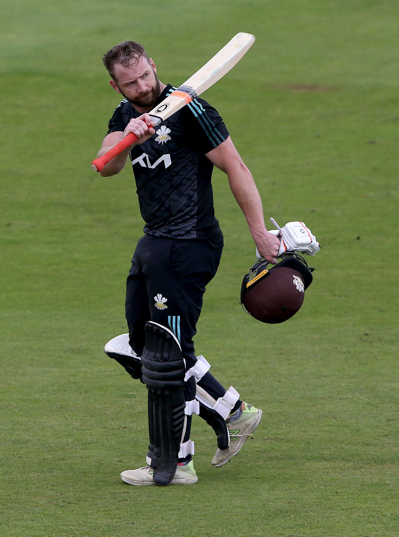 Mark Stoneman walks off after making a century