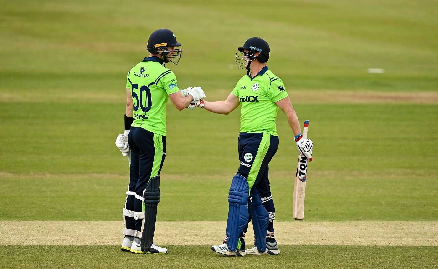 Kevin O'Brien is congratulated by George Dockrell after reaching a fifty