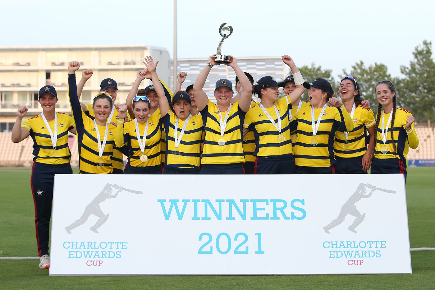 Bryony Smith holds aloft the Charlotte Edwards Cup