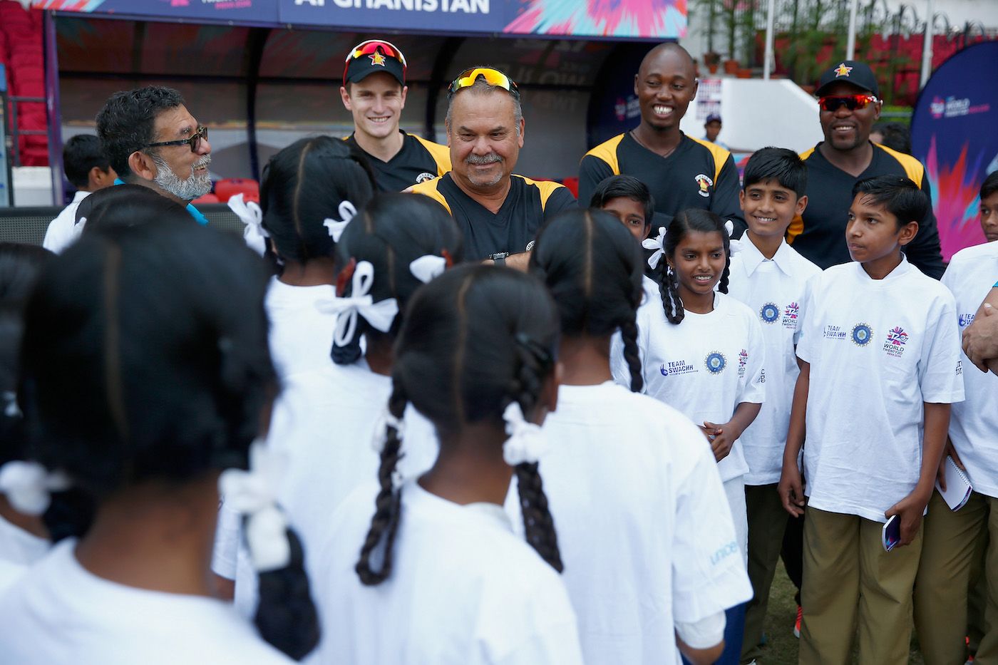Dav Whatmore and a group of Zimbabwe cricketers take part in the ICC's Cricket For Good programme
