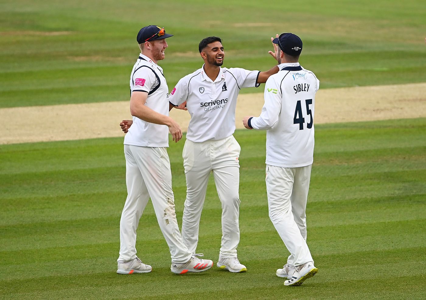 Manraj Johal celebrates his maiden first-class wicket
