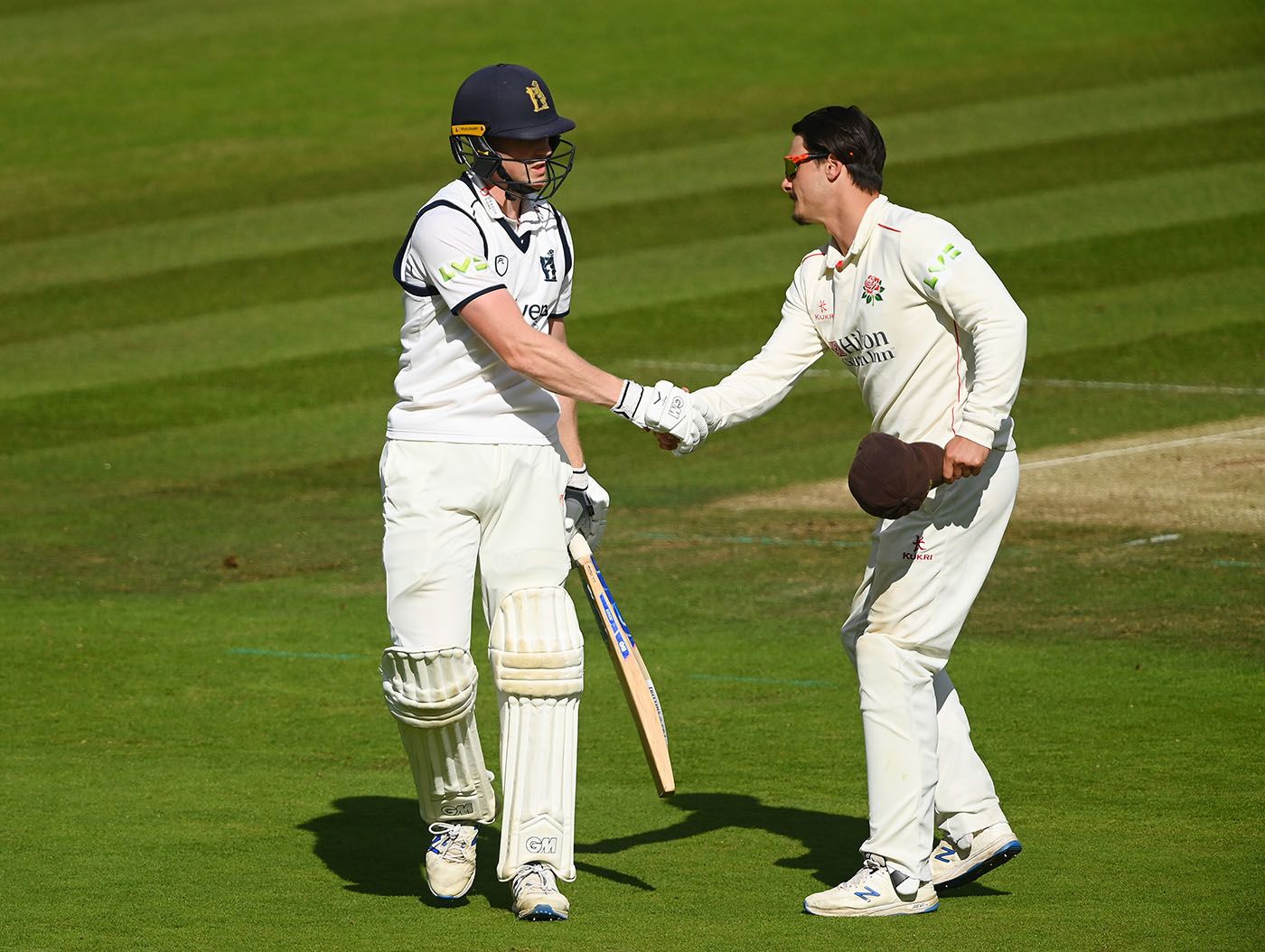 Rob Yates gets a handshake from Rob Jones after his dismissal