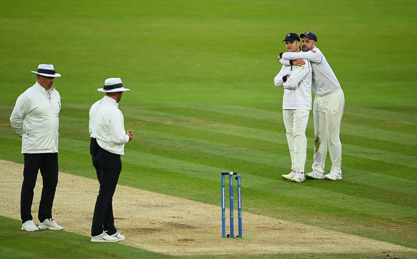 Sam Hain and Matt Lamb watch the umpires take the players off for bad light