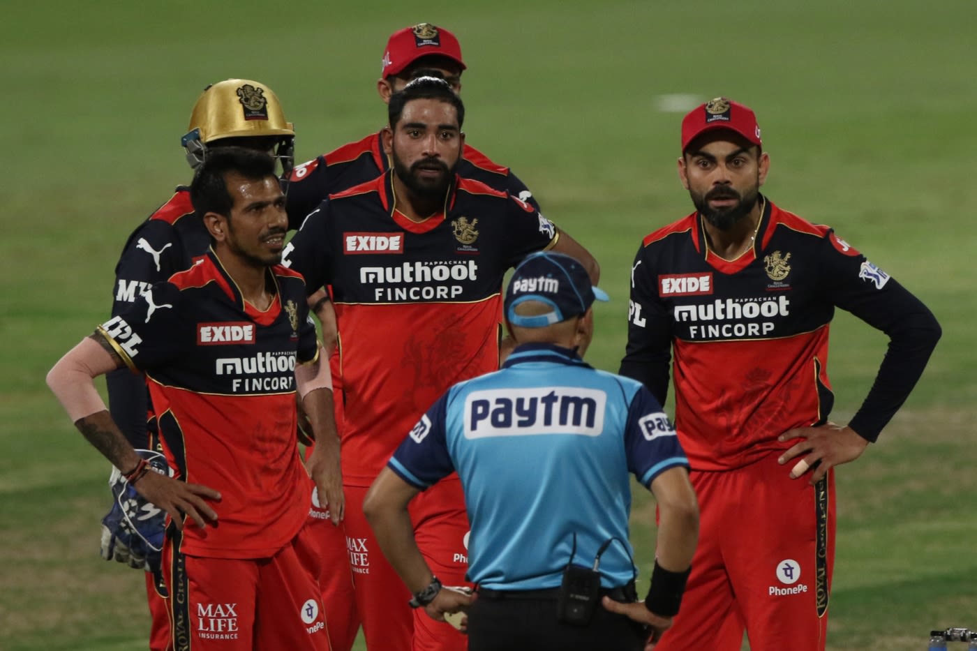 Virat Kohli was not a happy man as RCB had to review - successfully - to have a lbw call against Rahul Tripathi given. Here he talks to umpire Virender Sharma