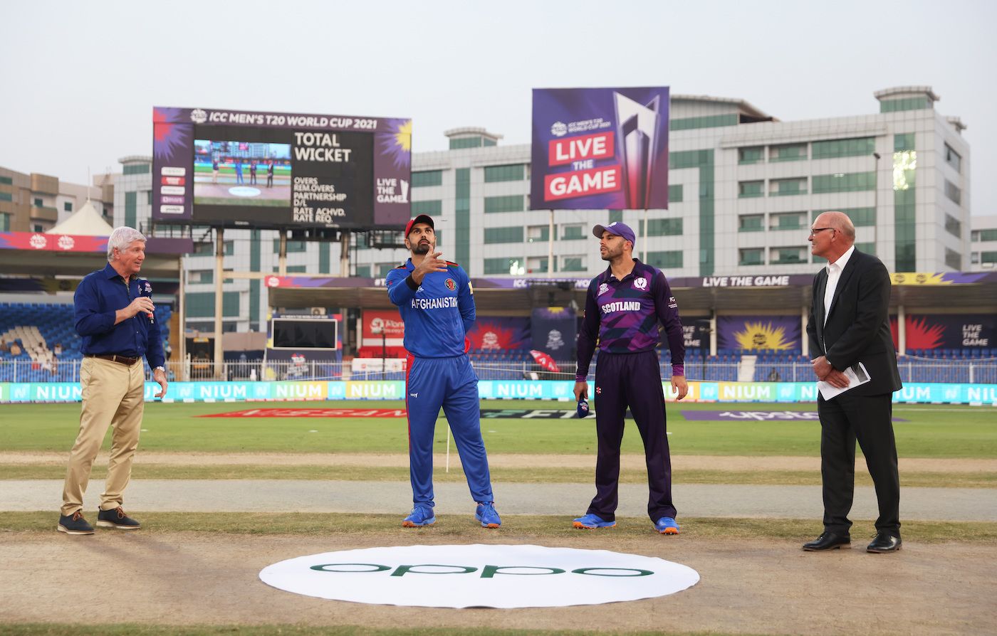 Alan Wilkins, Kyle Coetzer and Jeff Crowe watch as Mohammad Nabi flips the coin