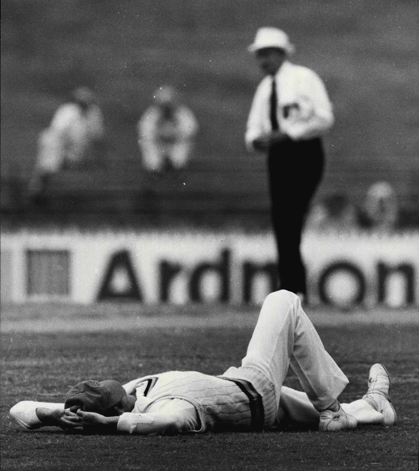 Ashley Mallett takes a nap during a break in the game