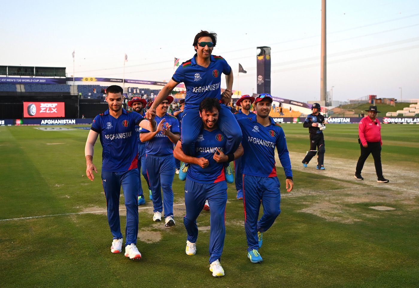 Asghar Afghan is carried by Gulbadin Naib as the Afghanistan team gives him a farewell