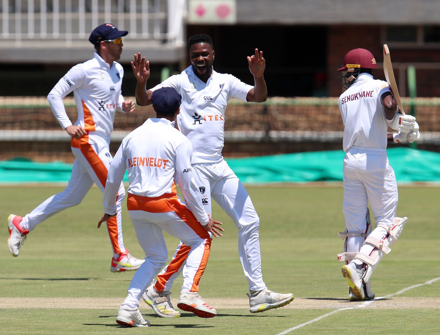 Mbulelo Budaza celebrates with Matthew Kleinveldt the wicket of Lesogo Senokwane