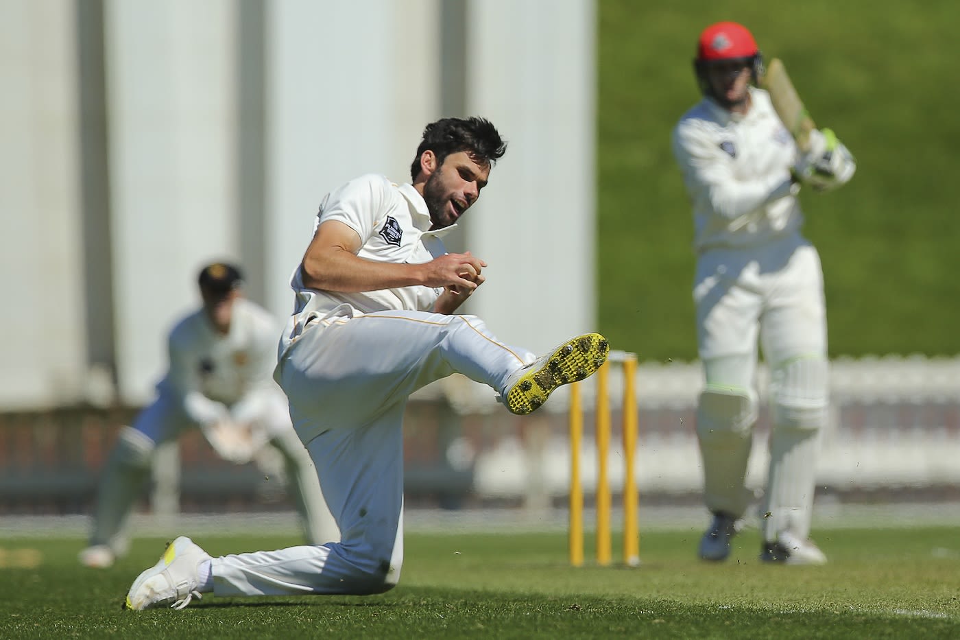 Michael Snedden takes a catch off his own bowling to dismiss Fraser Sheat