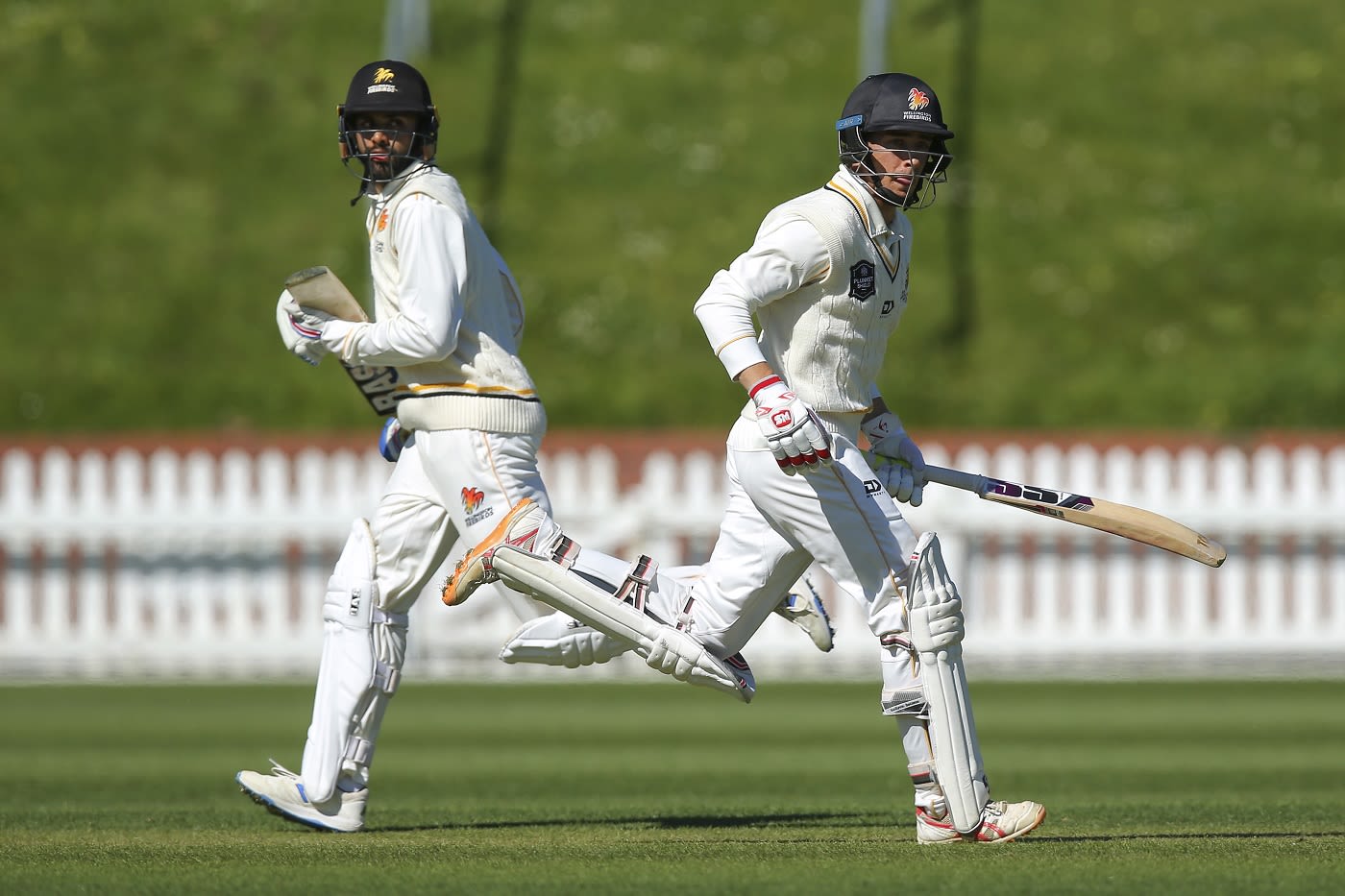 Jakob Bhula (L) and Nick Greenwood (R) run between the wickets