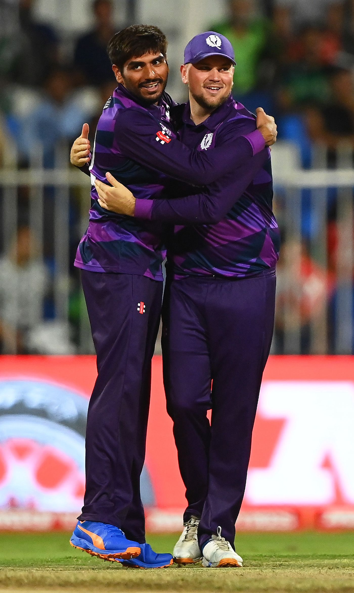 Hamza Tahir celebrates Mohammad Rizwan's wicket with Mark Watt