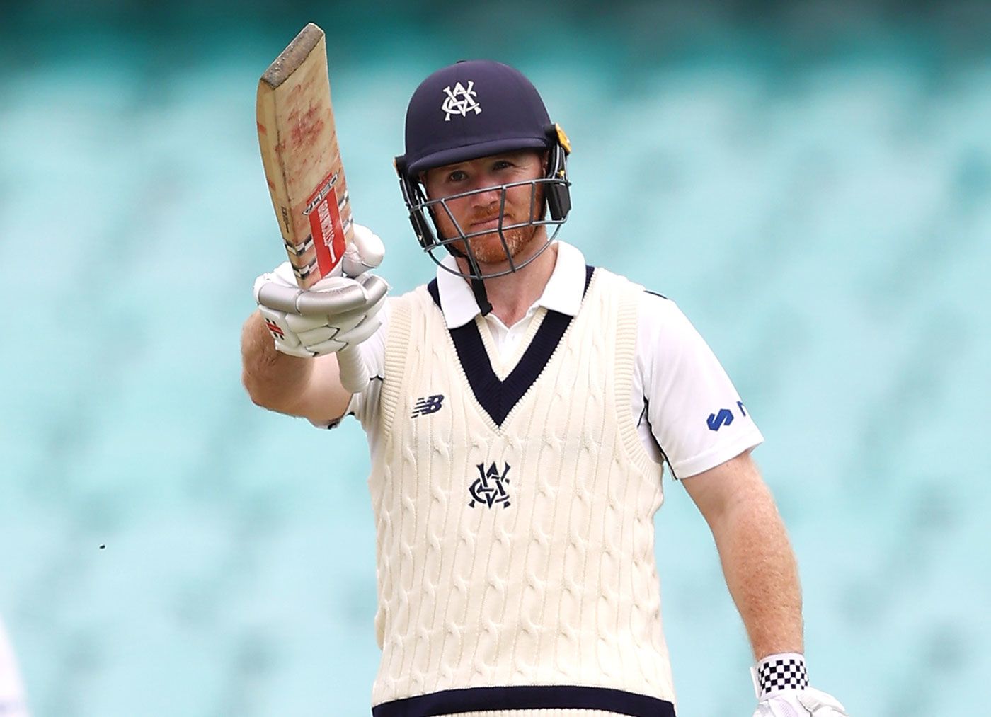 Travis Dean carried his bat