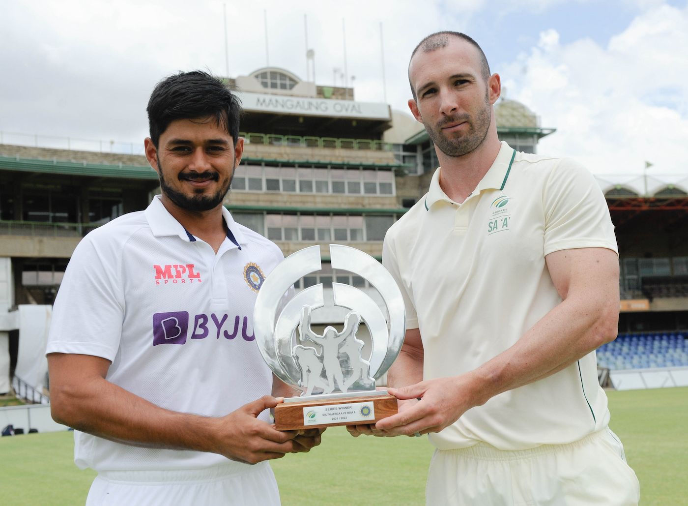 Priyank Panchal and Pieter Malan pose with the series trophy