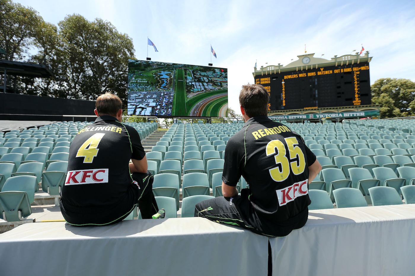 Doug Bollinger and Nathan Reardon watch the Melbourne Cup horse race