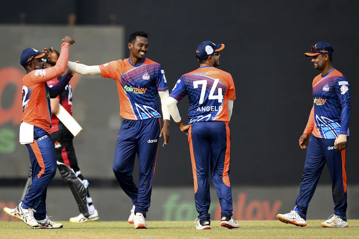 Kandy Warriors Al-Amin Hossain celebrates with team-mates
