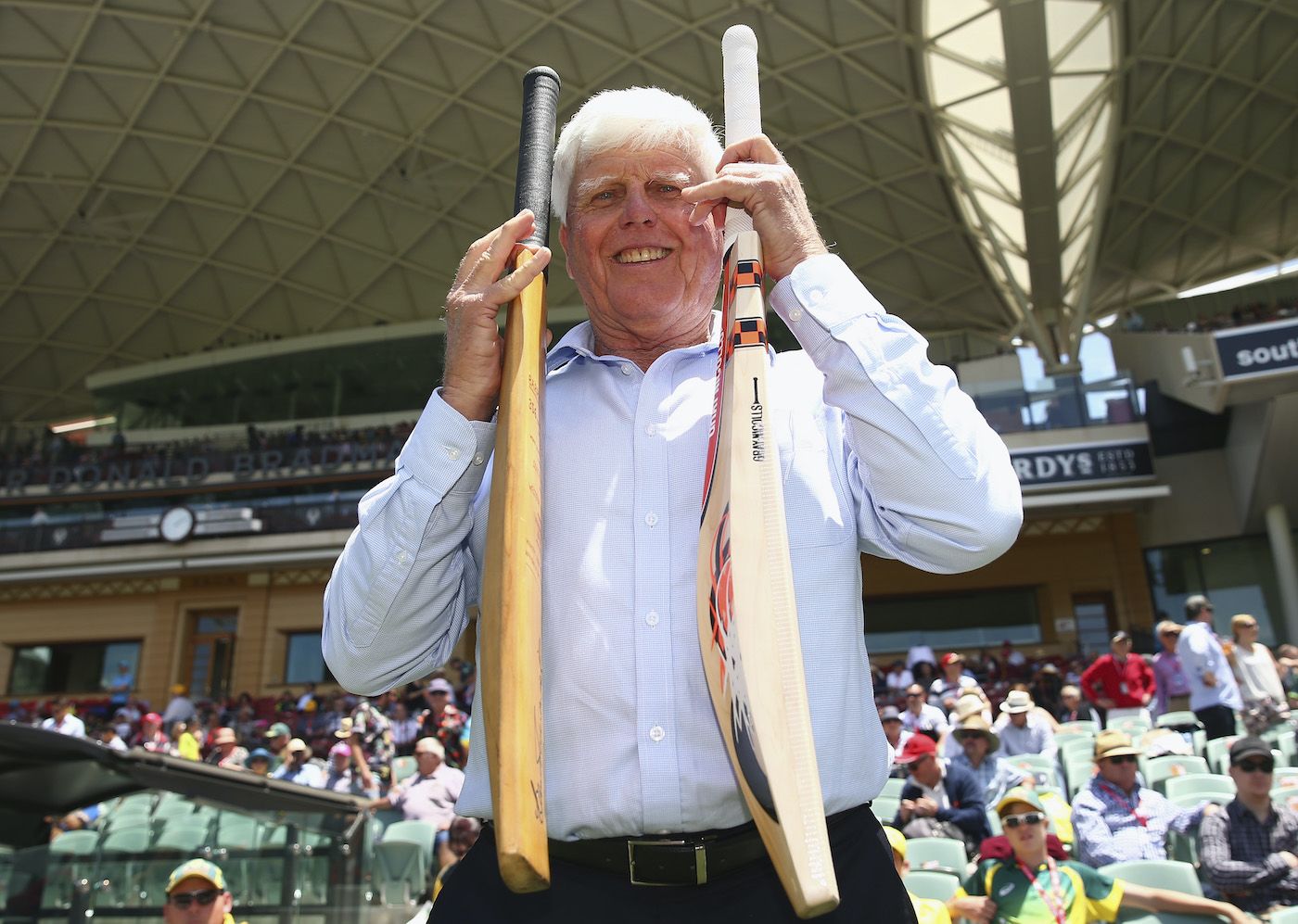Barry Richards holds the bat with which he made 325 in a day at the WACA in 1970 in his right hand, and David Warner's modern-day weapon in his left