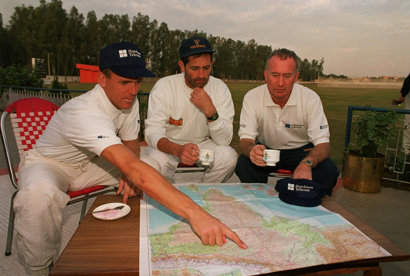 Alec Stewart, Graham Gooch and Keith Fletcher look at a map of India