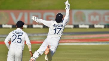 What is the record for the most caught-behind wicketkeeping dismissals in Tests?