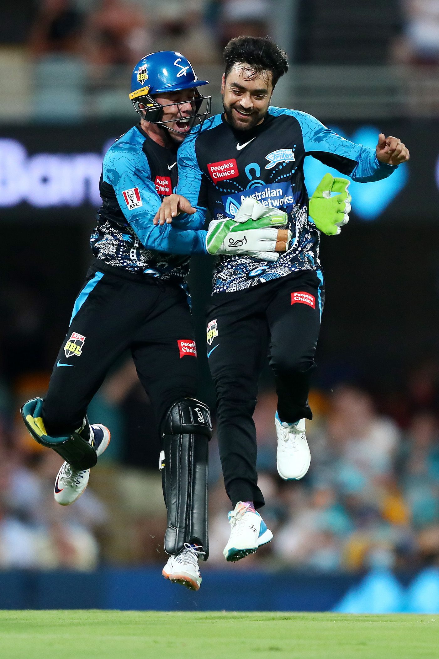 Harry Nielsen and Rashid Khan celebrate