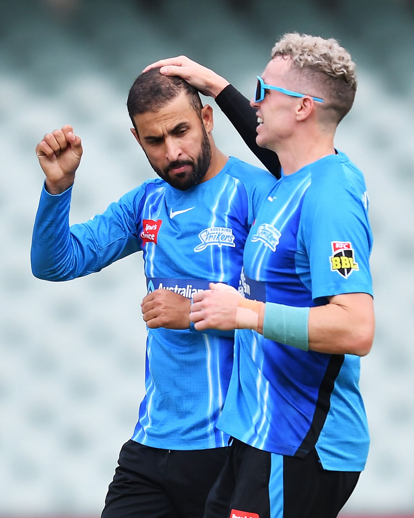 Fawad Ahmed celebrates a wicket with Peter Siddle