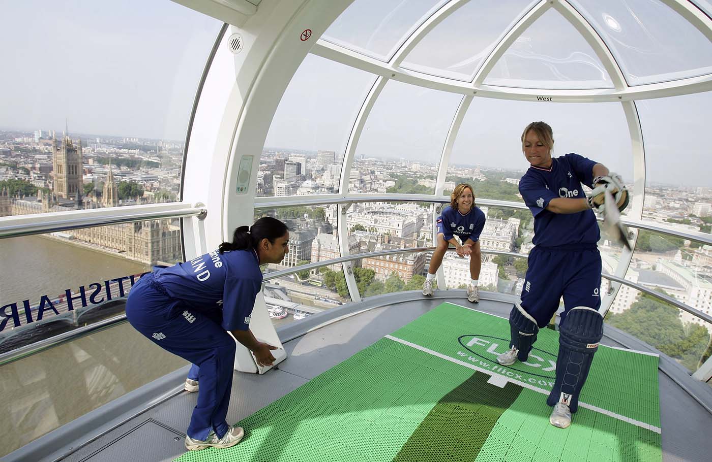 Isa Guha, Rosalie Birch and Clare Connor play during a promotional shoot on the London Eye