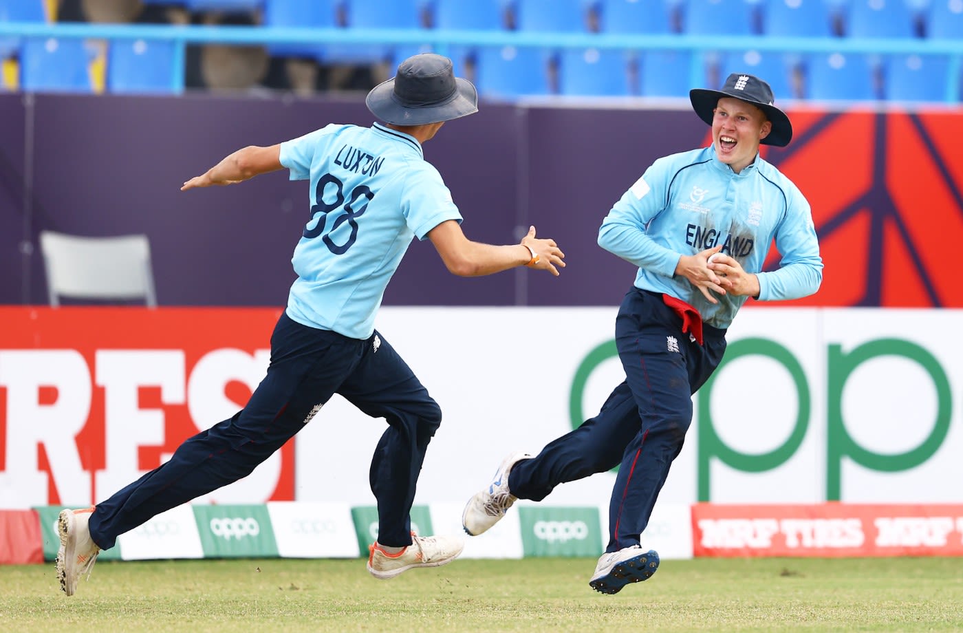 James Rew completes a catch in the deep and celebrates with Will Luxton