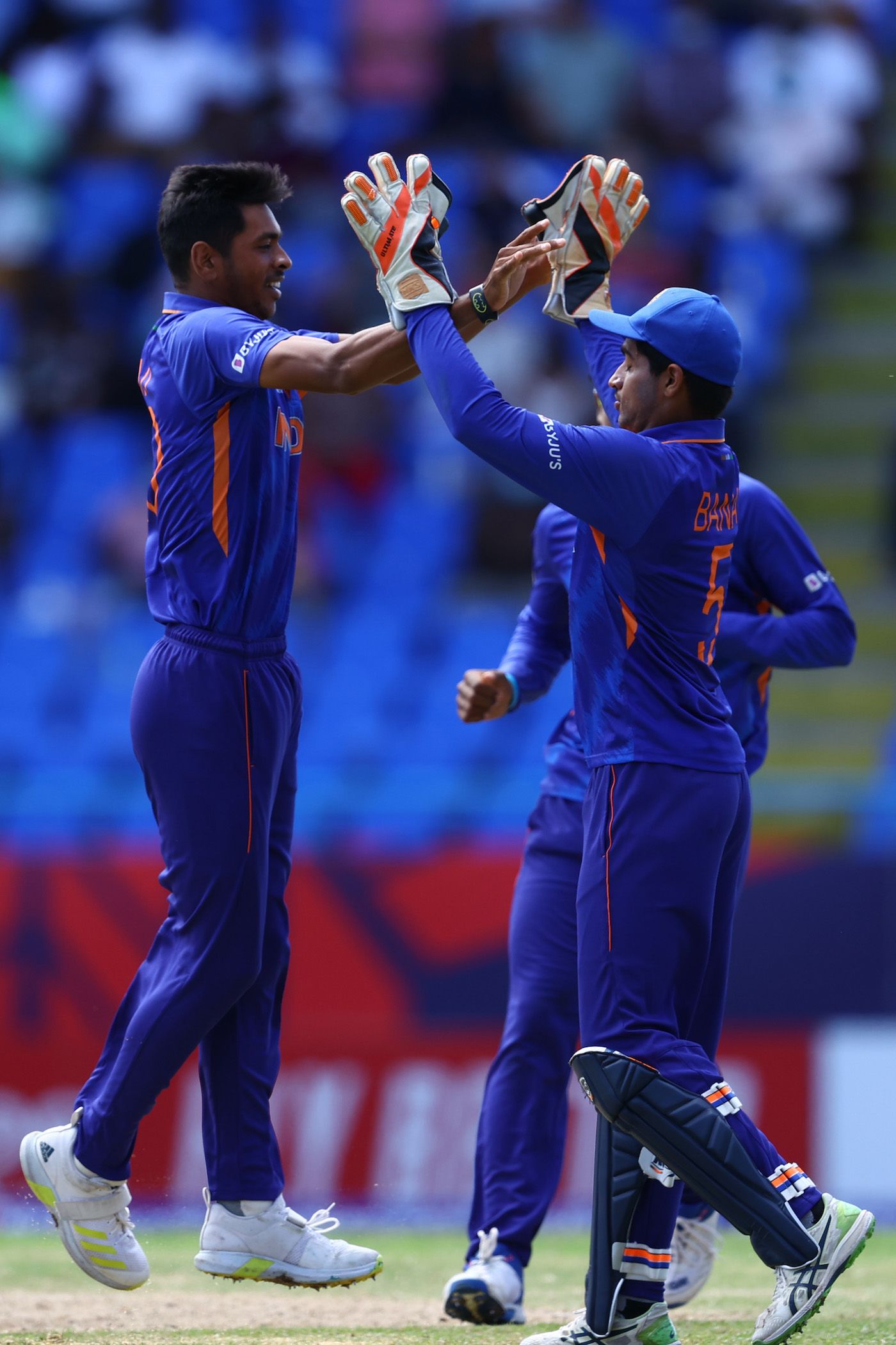 Ravi Kumar and Dinesh Bana celebrate a wicket