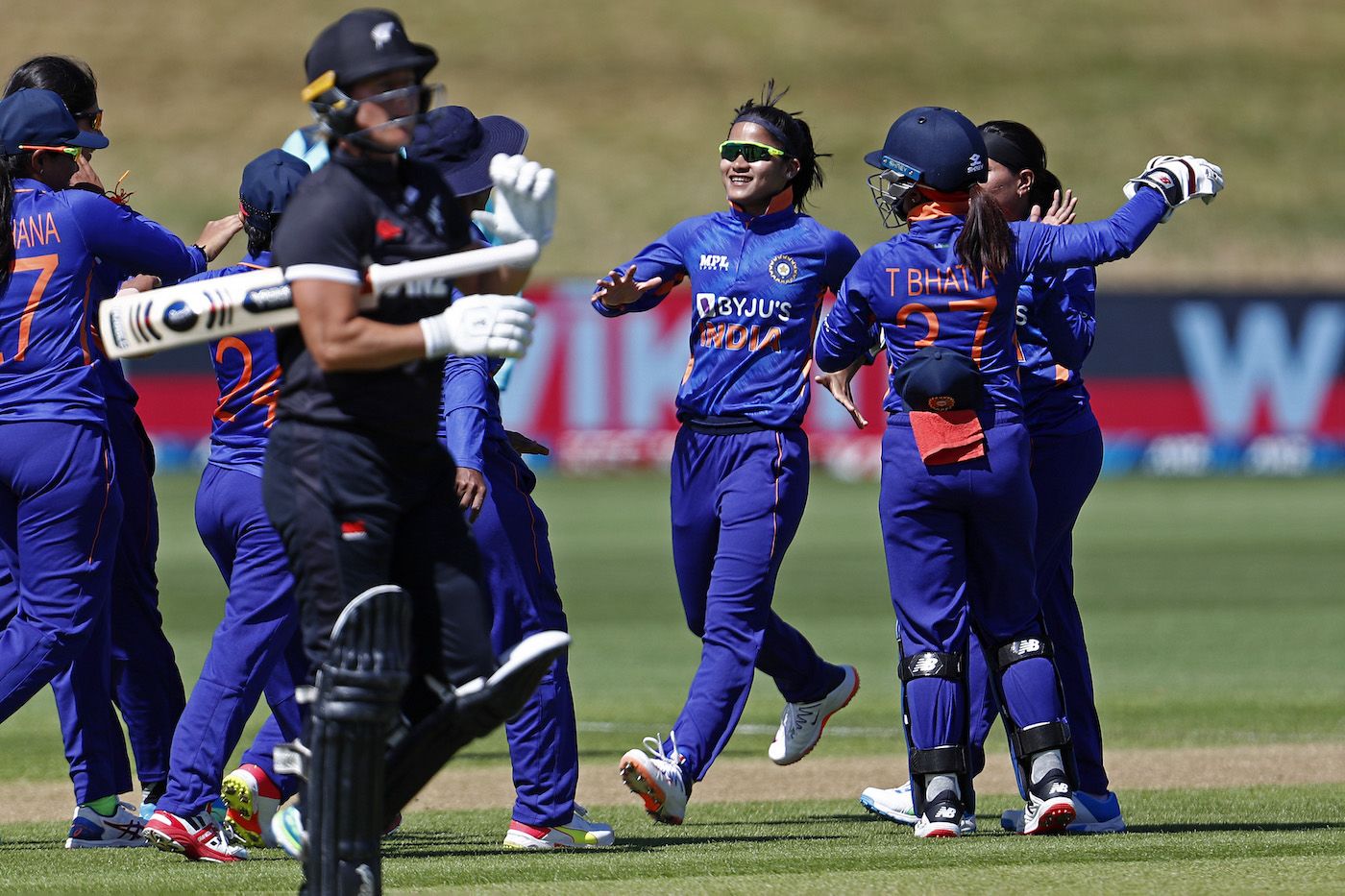 Simran Bahadur runs in to celebrate the dismissal of Sophie Devine