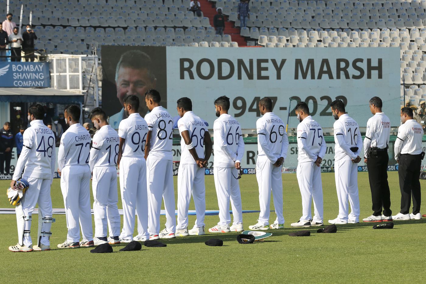 The Sri Lankan players observe a minute's silence in the memory of Rodney Marsh, and Shane Warne