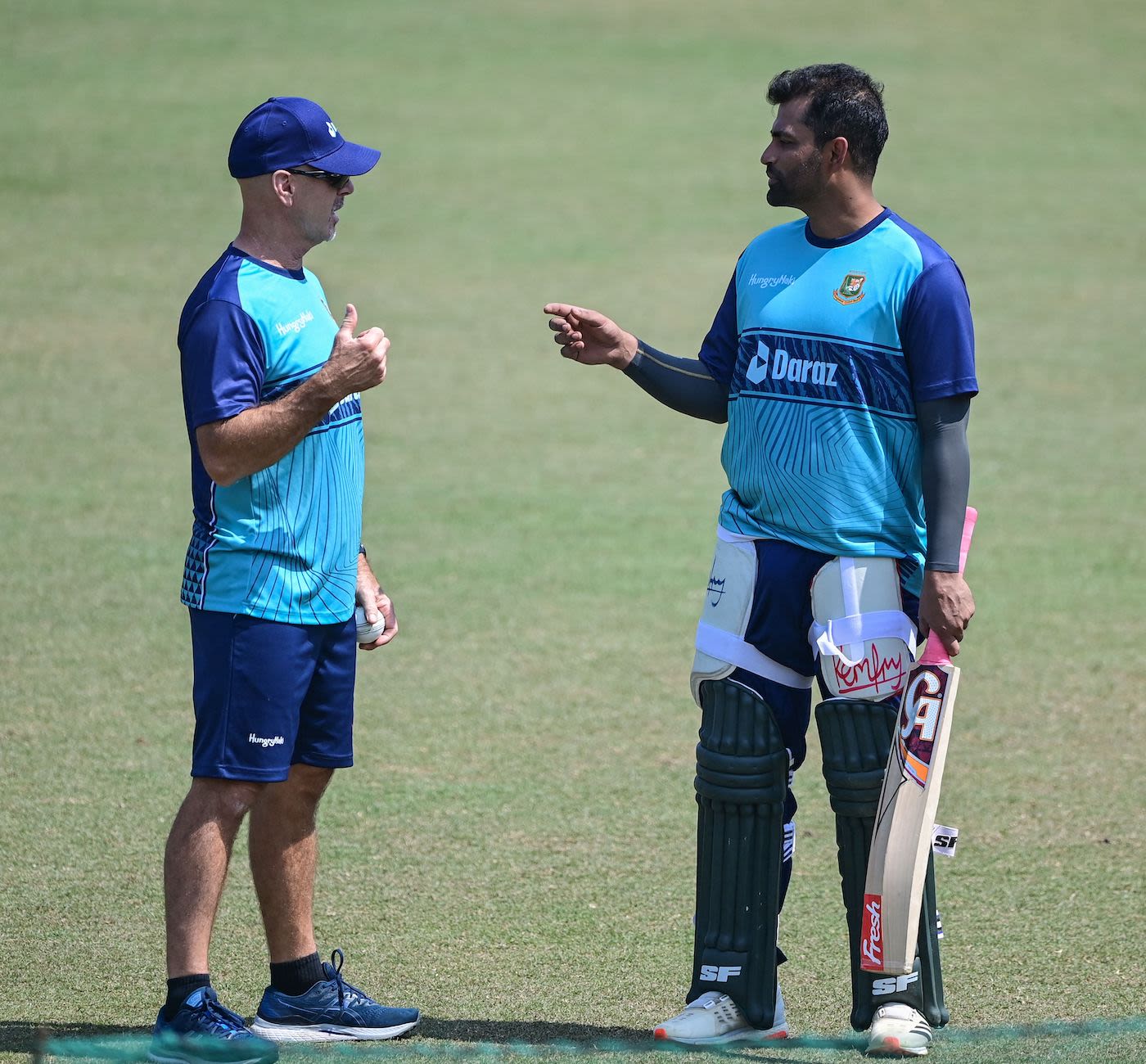 Jamie Siddons and Tamim Iqbal catch up during a training session