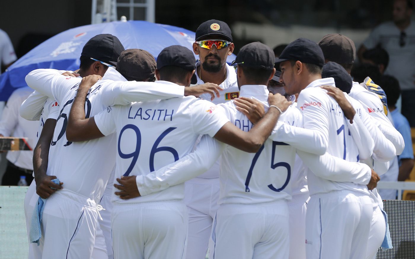 Suranga Lakmal, playing his final Test, looks on as the Sri Lankans huddle