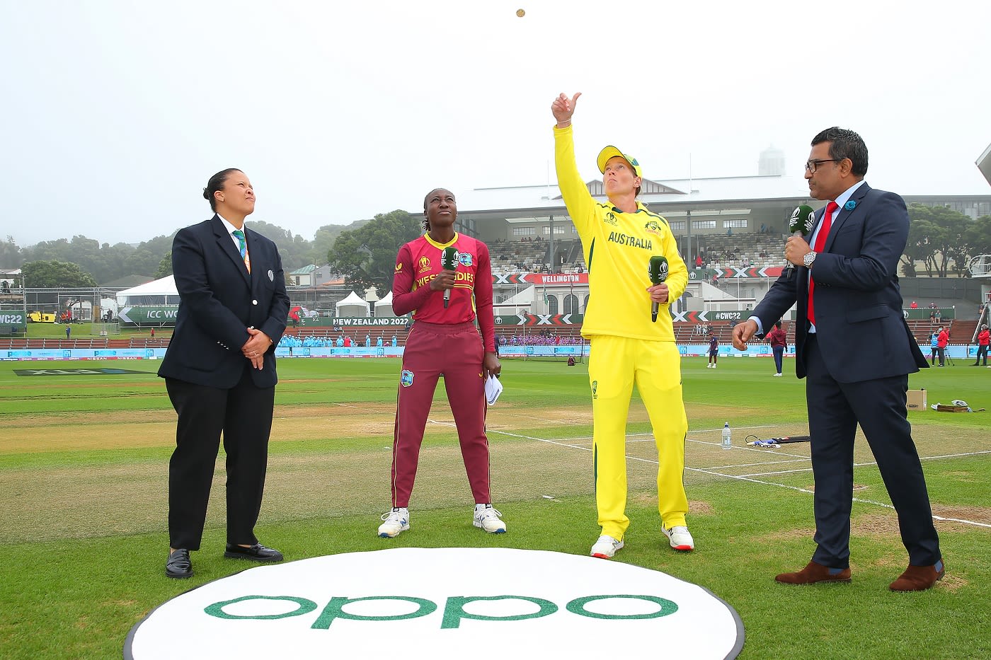 Stafanie Taylor and Meg Lanning take part in the coin toss in the company of broadcaster Sanjay Manjrekar