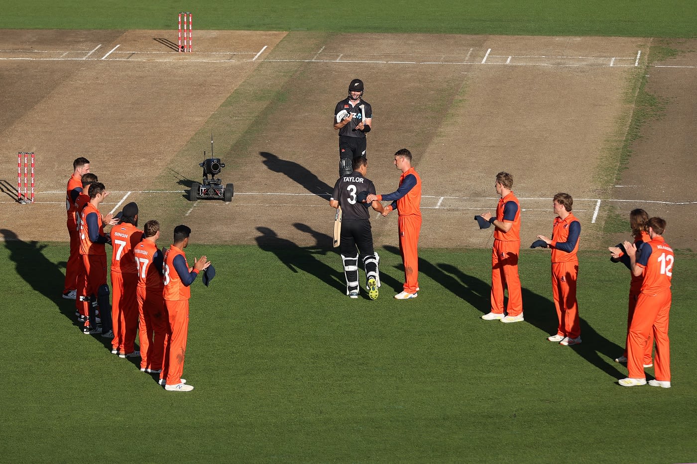 Netherlands captain Pieter Seelaar shakes hands with Ross Taylor ahead of his final international innings
