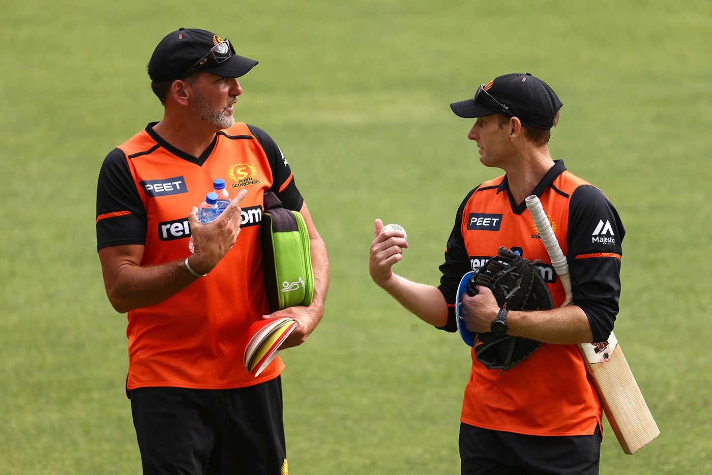 Matt Mason (left) chats to Perth Scorchers coach Adam Voges