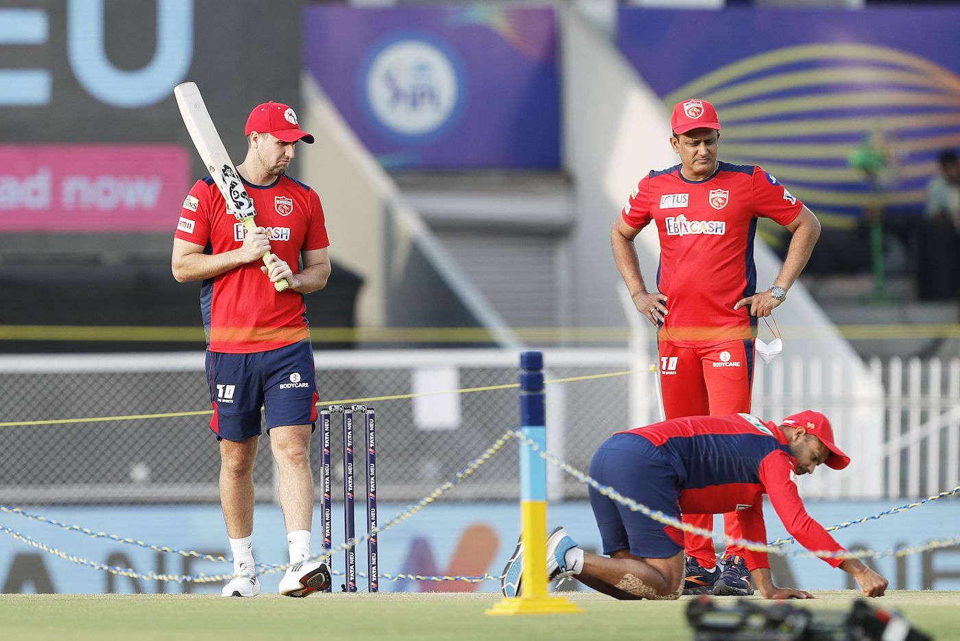 Liam Livingstone, Anil Kumble and Mayank Agarwal have a look at the pitch